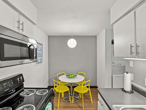 apartment kitchen with a stove and microwave