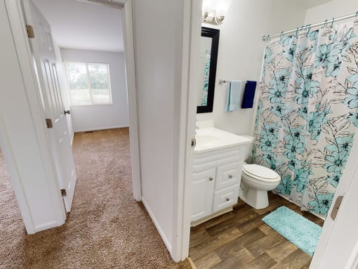 hardwood style flooring in Lima Townhome bathroom