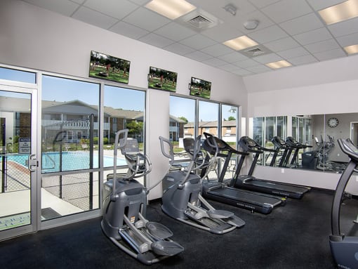 fitness center overlooking pool at north park apartments