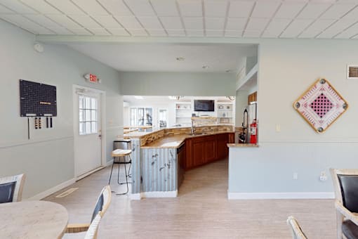 A kitchen with a wooden counter and a white ceiling.