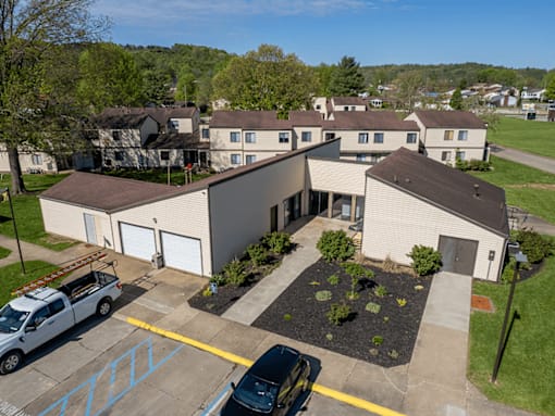 A building with a parking lot in front of it.