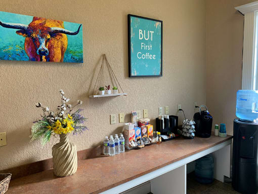 a counter with a vase of flowers on top of it