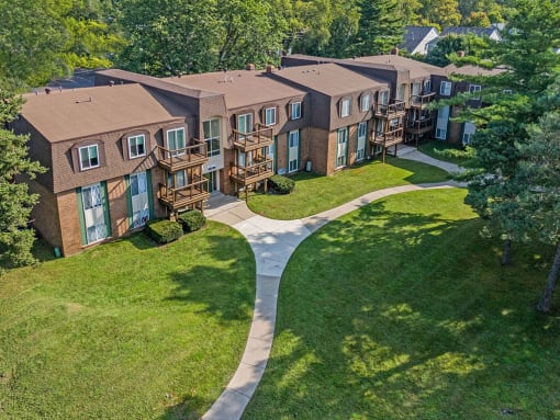 an aerial view of an apartment complex with walkways and balconies