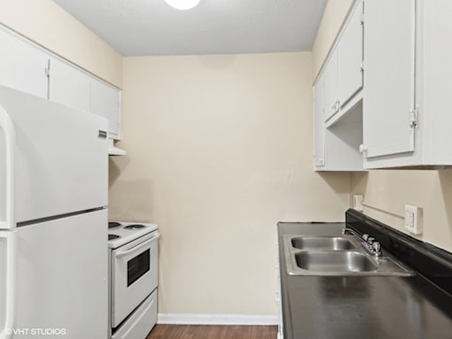 kitchen with white appliances and cabinets