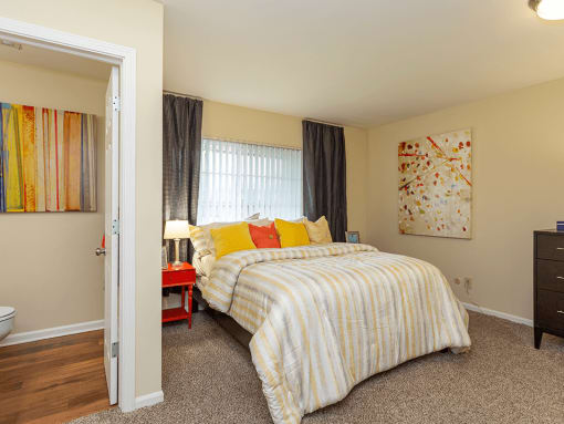 primary bedroom with attached bedroom at preserve at woodland