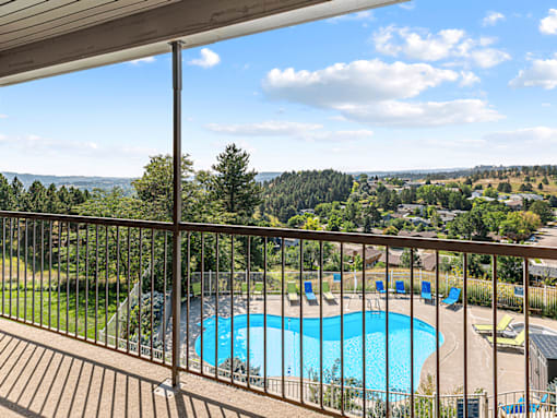 A pool with a view of the mountains.