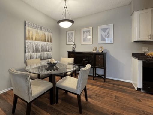 a dining room with a table and chairs