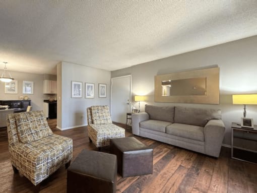 a living room with a couch and two chairs