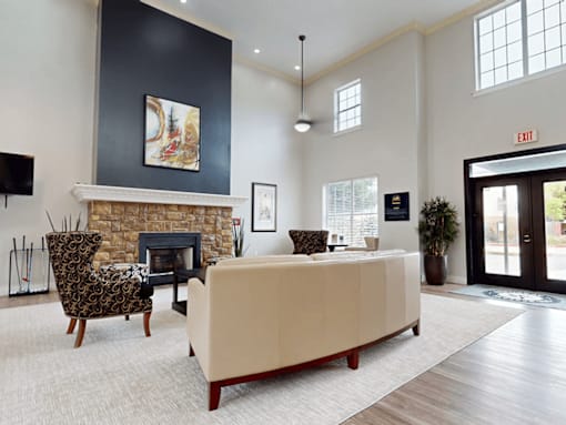 A living room with a fireplace and a couch.