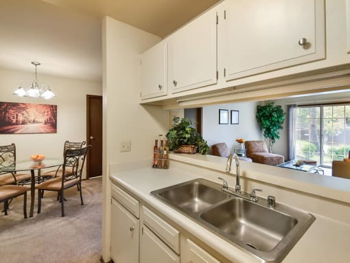 kitchen with double sink and connected dining room 