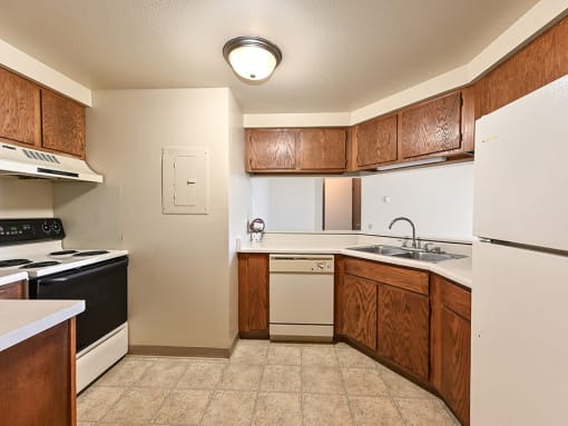 kitchen with oven, refrigerator and dishwasher