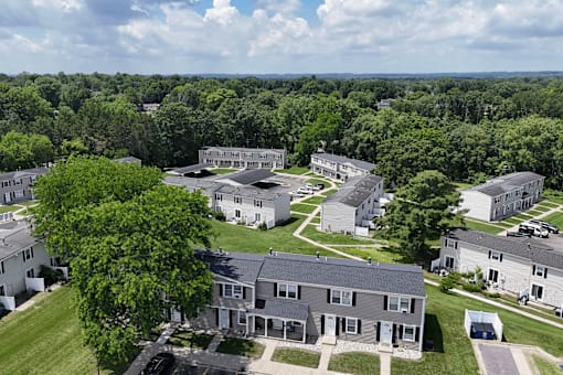 A bird's eye view of a residential area with houses and trees.
