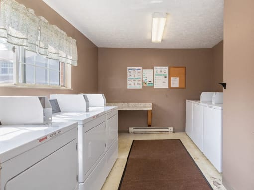 resident laundry room with washes and dryers