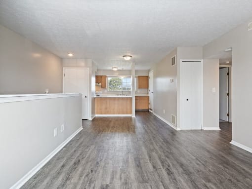apartment living room and kitchen with wood style flooring
