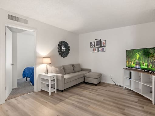 a living room with a couch and a tv