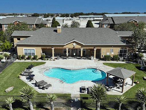 A large house with a pool in the backyard.