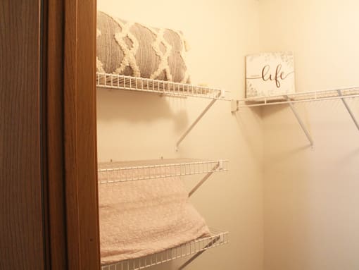 a towel rack in a small bathroom