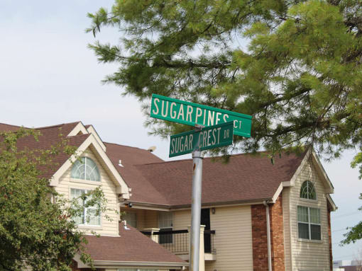 a street sign in front of a house
