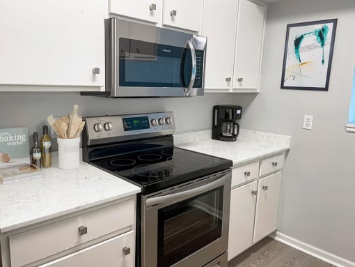 kitchen with microwave and oven at shoreline landing apartments