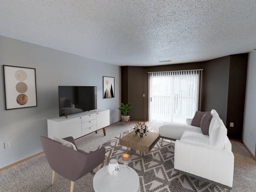 a living room with a couch and sliding glass door