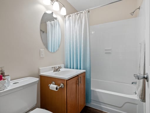 a bathroom with a toilet sink and tub