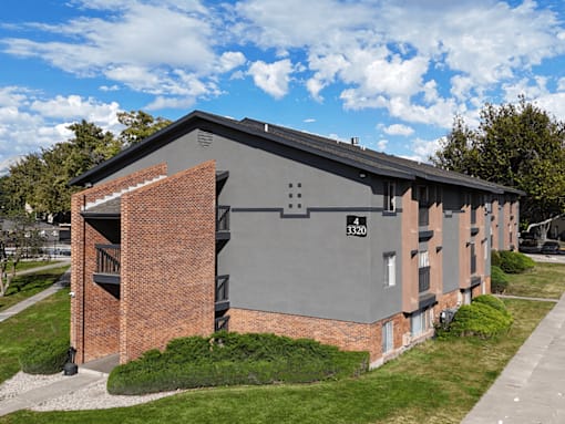 A grey building with the number 3320 on it.