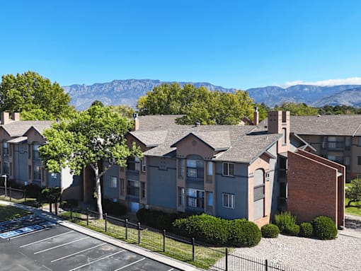 Apartment complex with a mountain range in the background.