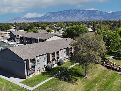 Apartment complex with a mountain in the background.