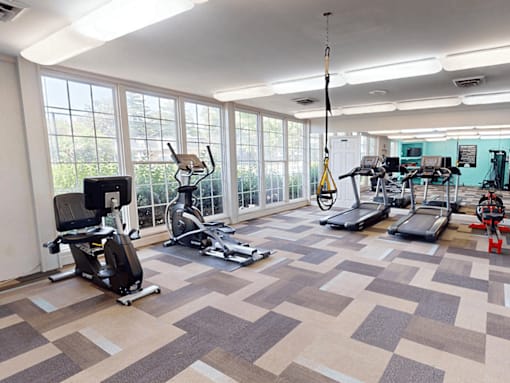 A home gym with a variety of exercise equipment.