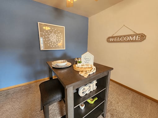 A dining table with a sign that says eat on it.