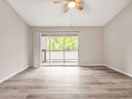 Living area that opens out to a screened patio