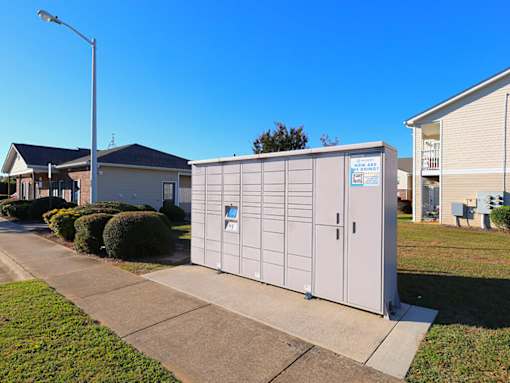 A grey storage unit with a blue sign on it.