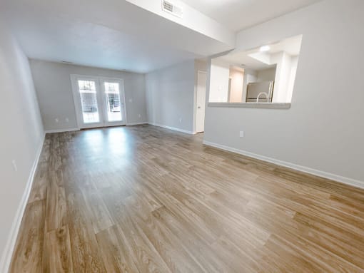 wood-style flooring in spacious living room at the plaza at lamberton 