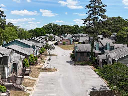 A residential area with houses and trees.