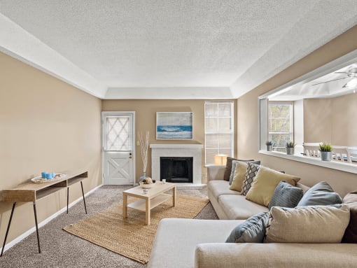 a living room with a couch and a fireplace