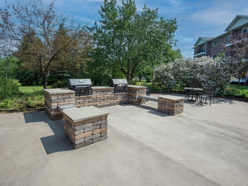 the backyard has a large patio with a grill and bbq area