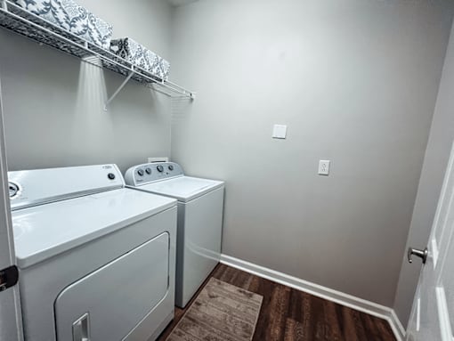 In-home laundry room with a washer and dryer.