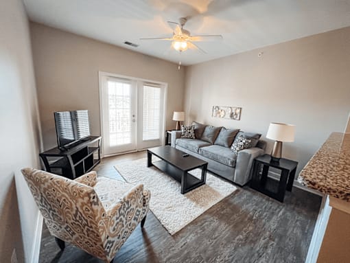 A living room with hardwood style flooring