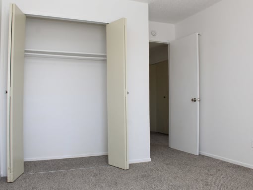 bedroom with attached closet at village green