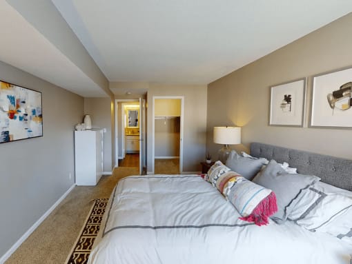 a bedroom with a bed and a ceiling with circles on it