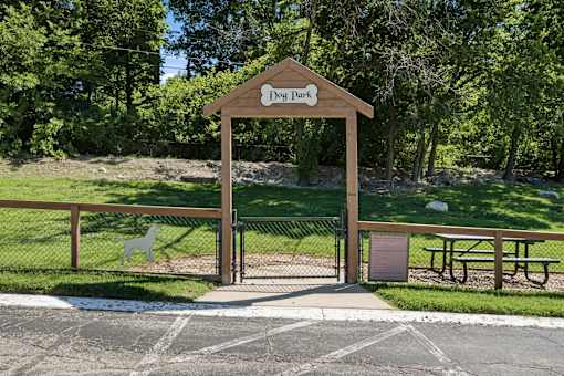 A sign that says Dog Park