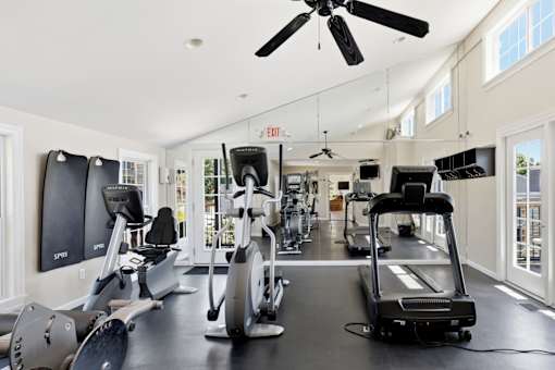 A spacious gym with a variety of exercise equipment.