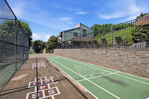 A tennis court with the numbers 18 and 19 painted on it.