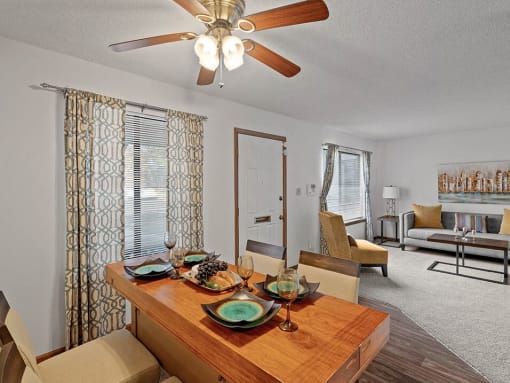 entry way to a home with a dining room and living room in the background