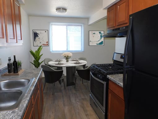 Dining Room with Natural Light at West Broadway Apartments