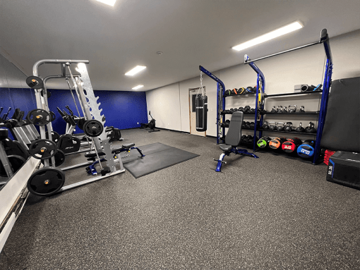 a fully equipped gym with weights and other exercise equipment