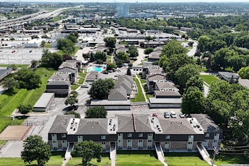 A bird's eye view of a residential area with houses and apartment buildings.