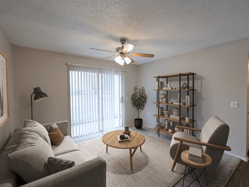 an open living room with a ceiling fan and a window