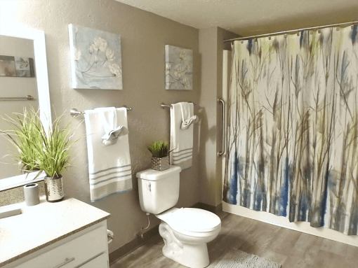Large full bathroom with tub and storage