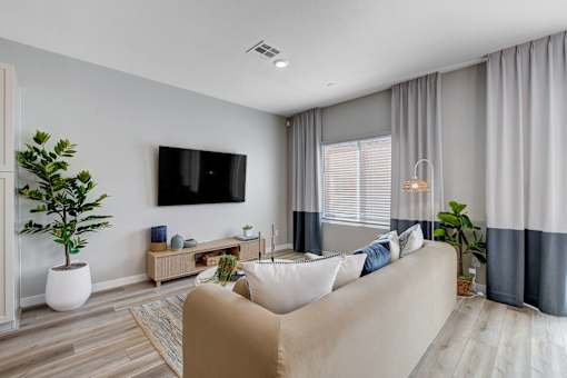 Living Room With TV at Copper Creek Apartments, Las Vegas